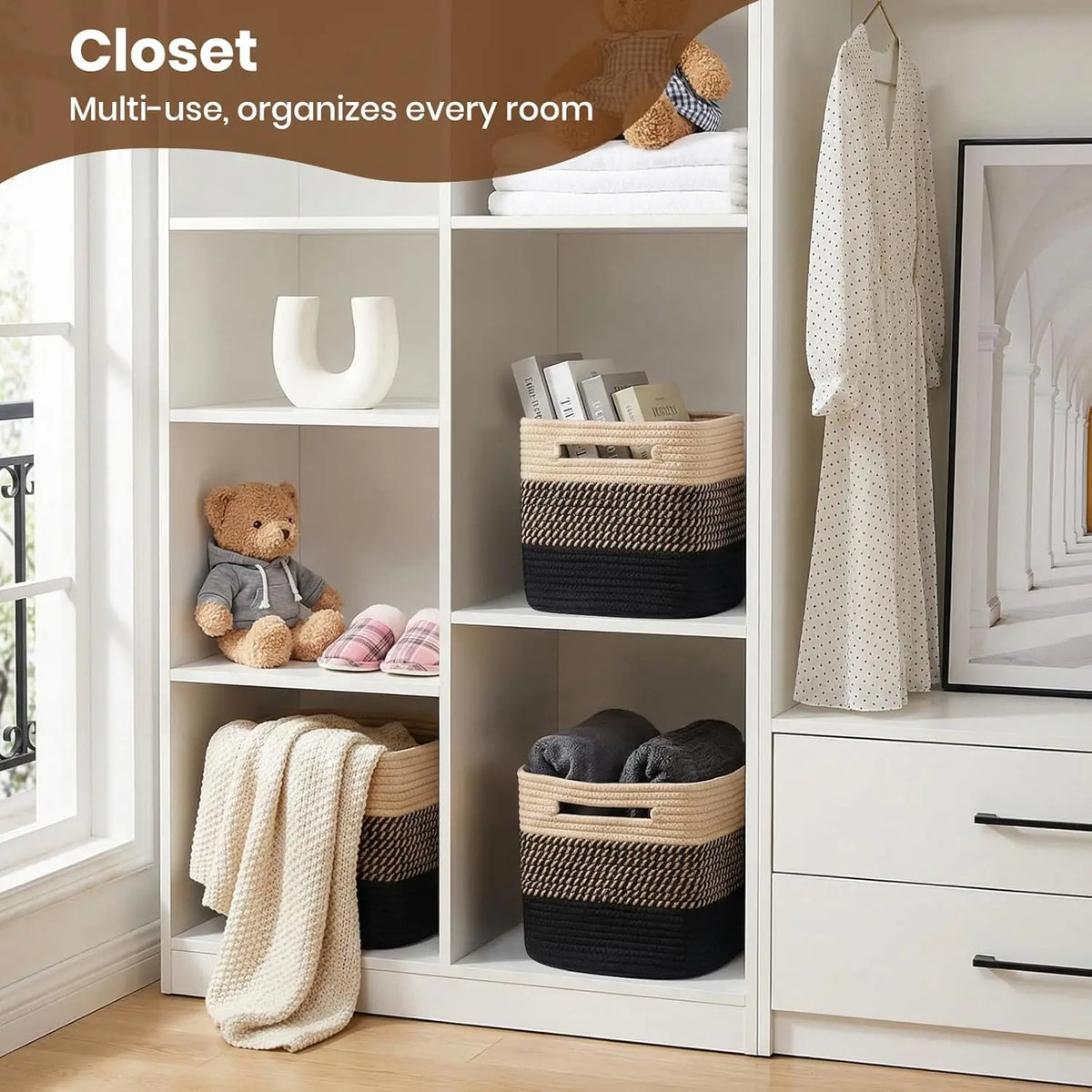 A white closet shelf unit displaying woven cotton rope storage baskets and a hanging garment.