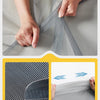 Hands are installing a magnetic screen door curtain using Velcro on a gray fabric.
