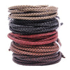 A stack of genuine braided leather cord in various shades of brown and black for jewelry making