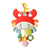 A red and orange hanging crab sensory toy with a rattle and teether for babies.