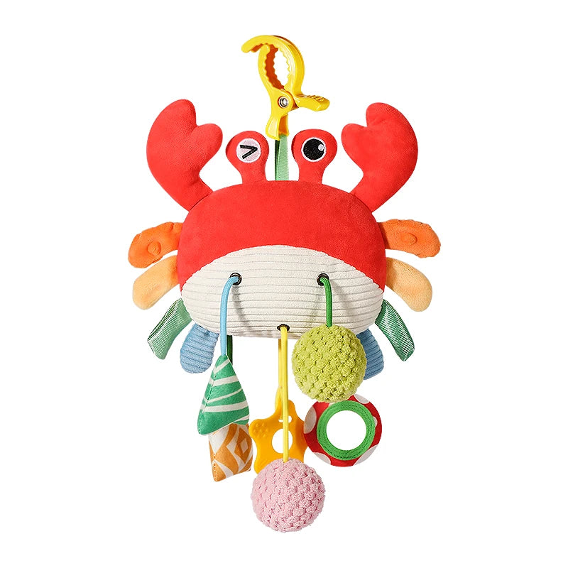A red and orange hanging crab sensory toy with a rattle and teether for babies.