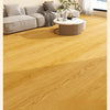A close-up view of light natural wood grain floor stickers installed on a wooden floor.