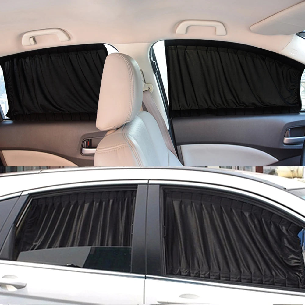 Interior view of a car showing black fabric side window sun shades covering the windows.