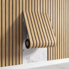 Roll of light wood 3D self-adhesive wall panels mounted on a white shelf