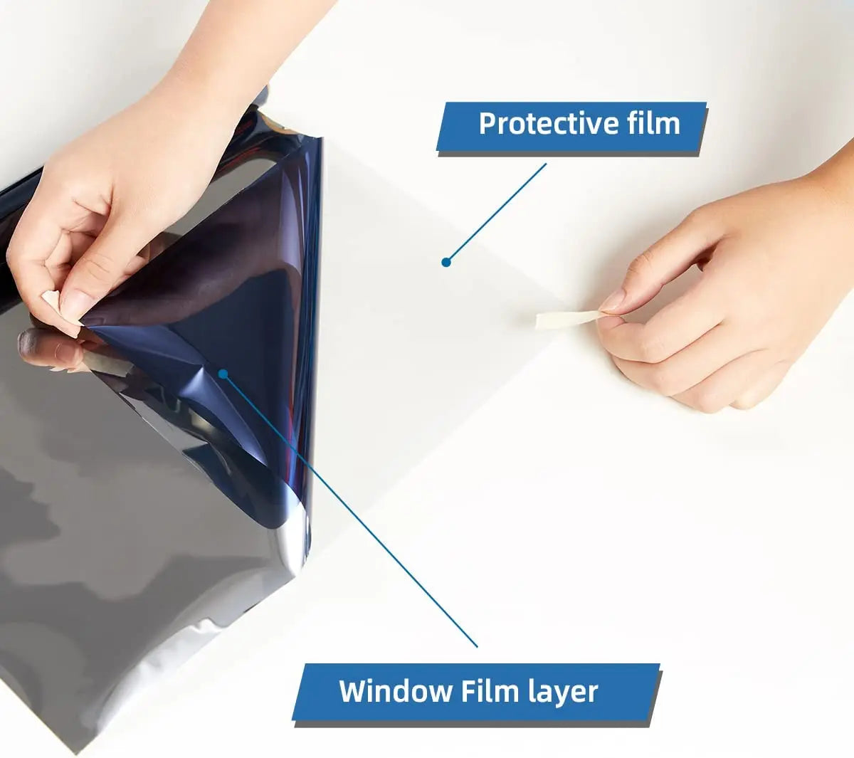 A hand is applying a protective film onto a car window, showing the window film layer and protective film.