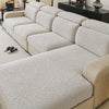 A light beige sofa cover featuring a textured, off-white jacquard fleece fabric with a subtle, intricate pattern.