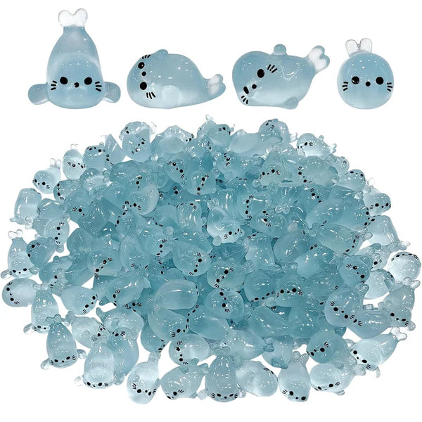 A collection of glow-in-the-dark mini seal figurines in various shapes and sizes.