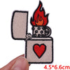 An embroidered iron-on patch set featuring a flame and a heart design on a light beige fabric.