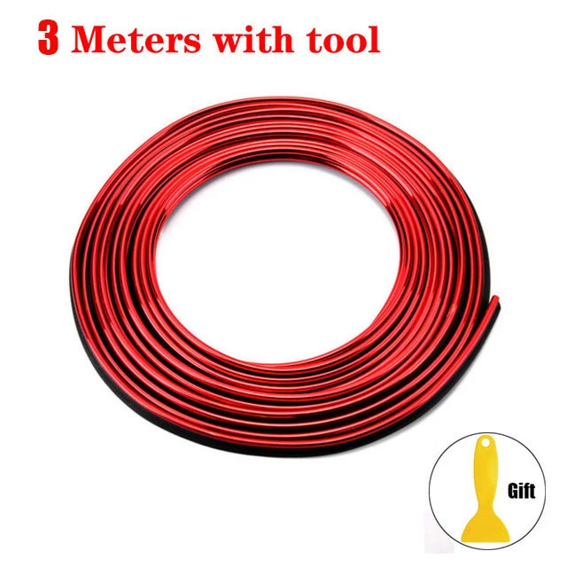 A coil of red flexible car interior trim strips with a tool.