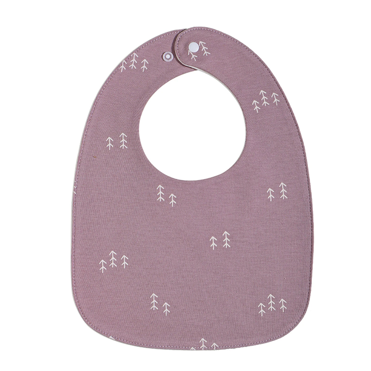 A mauve baby bib with a U-shaped design featuring small white tree patterns.
