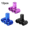 A set of four metal valve caps in various colors including pink, purple, and blue, featuring a hexagon design.