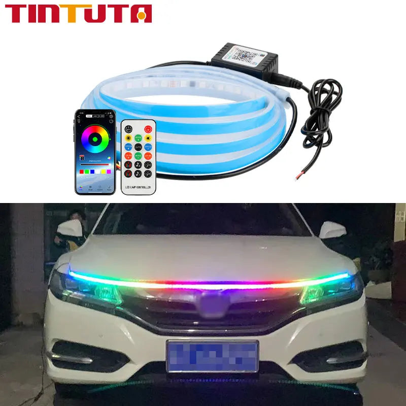 An RGB LED light strip is installed on a white car hood, illuminating the front grille area.