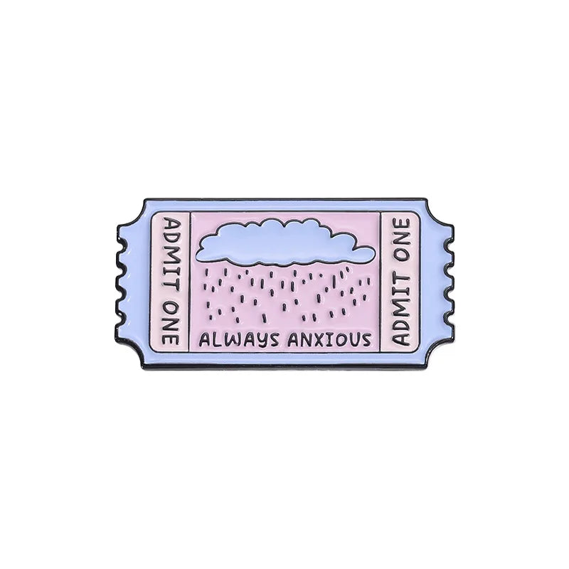 A vintage enamel brooch featuring a cloud design and the text Always Anxious on a rectangular background.