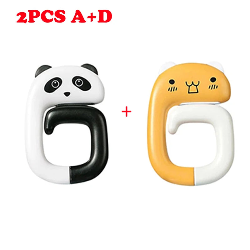 Two silicone bag hooks shaped like a panda and a tiger, used for hanging bags on tables or desks.