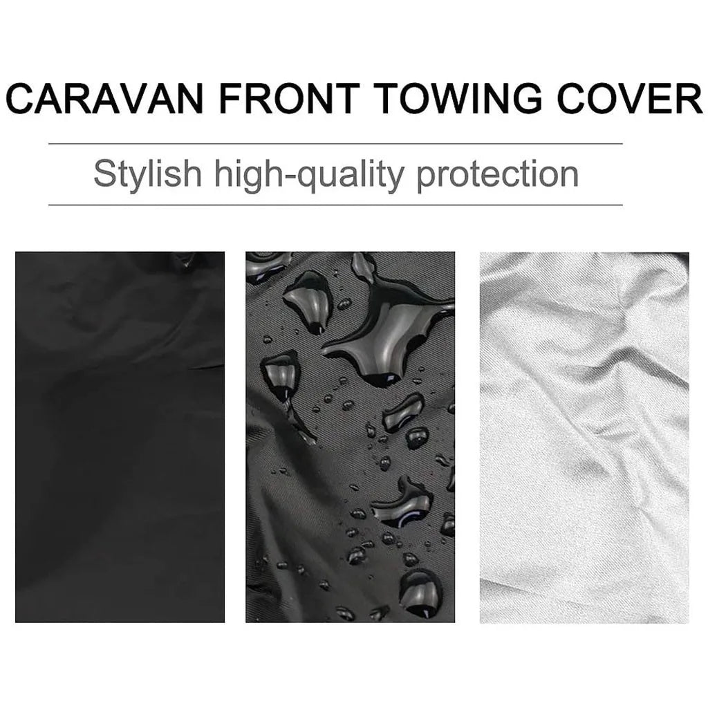 Close-up view of a black all-weather waterproof fire pit towing cover showing water droplets on the fabric.