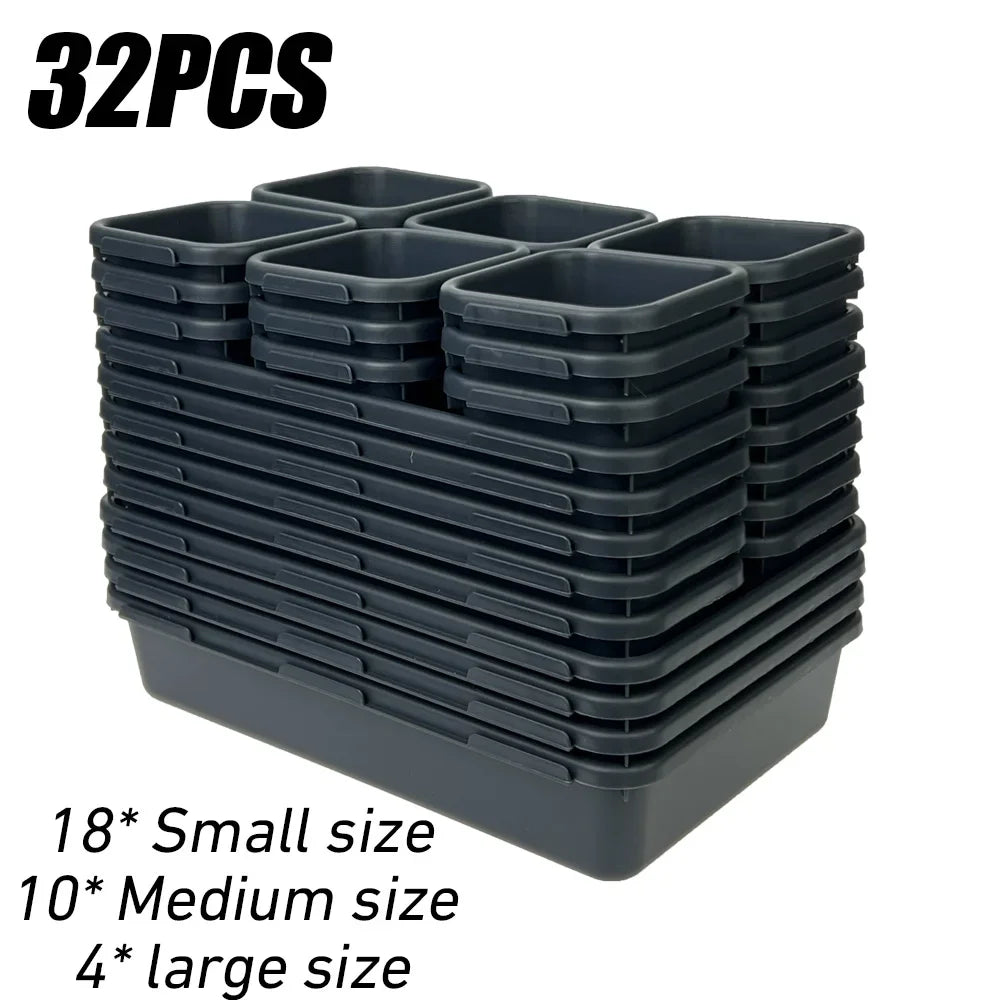 A stack of 32 modular drawer organizer trays in black, including small, medium, and large sizes.