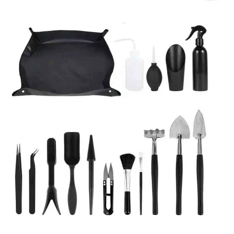 A set of gardening tools for succulents and bonsai including various small hand tools and a large tray.