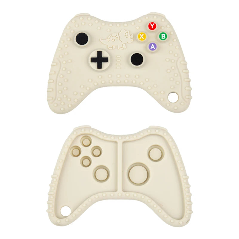 A beige silicone baby teether toy shaped like a remote control, featuring various colored buttons and a plus sign.