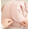 A hand is opening the zipper of a pink quilted PU leather insulated lunch tote bag.