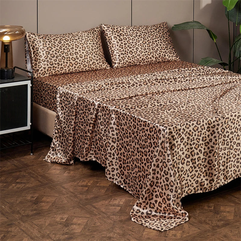 Luxury satin leopard print bedding set featuring brown and black animal print fabric on a bed.
