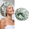 A close-up of a woman wearing a large, satin-lined waterproof shower cap for hair protection.