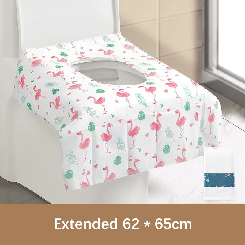 White and pink floral patterned disposable toilet seat covers displayed on a white toilet seat.