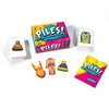 A collection of piles of folding clothes and poker cards for a family game night featuring colorful packaging.