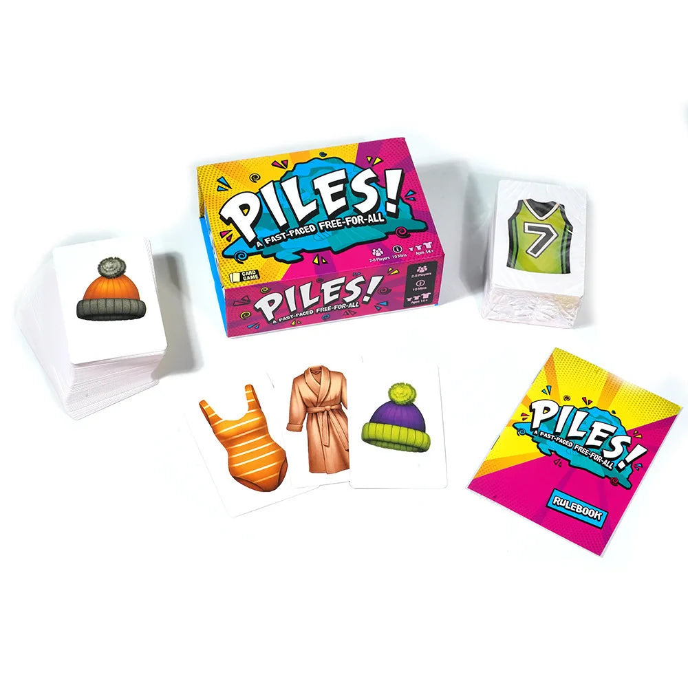 A collection of piles of folding clothes and poker cards for a family game night featuring colorful packaging.