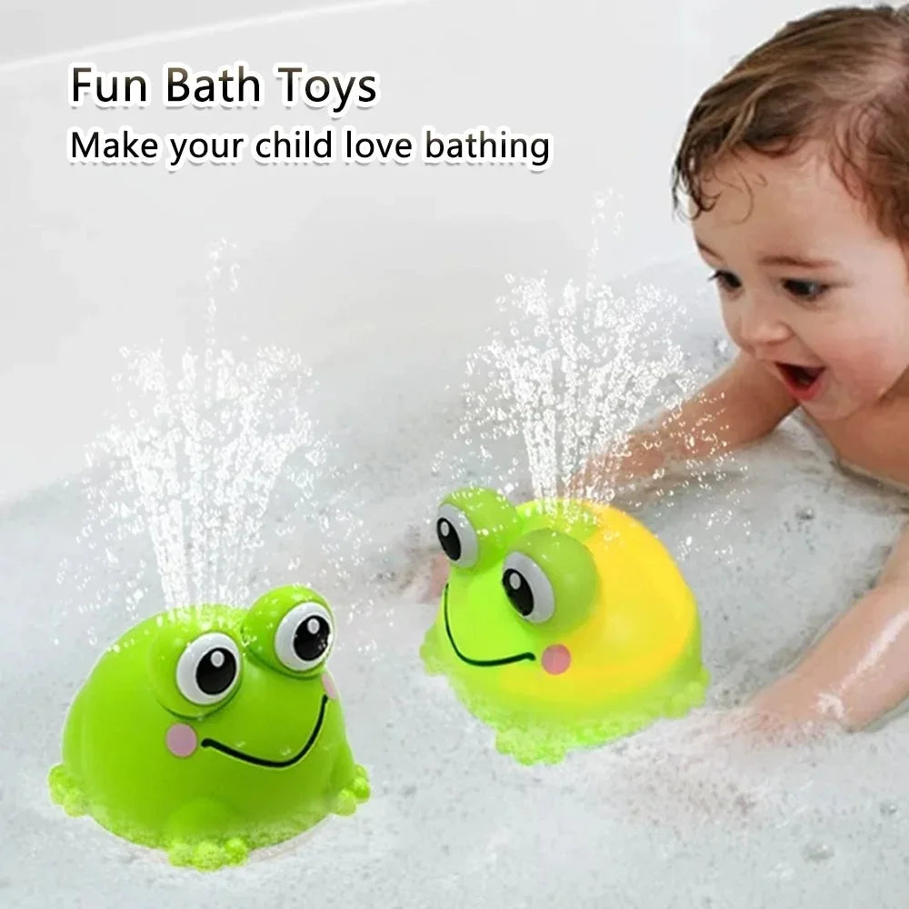 A bright yellow and green bath toy frog is spraying water in a bathtub for a baby.