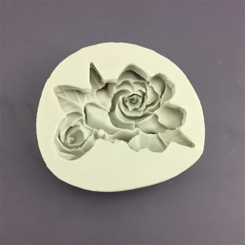 A white silicone mold shaped like a detailed rose flower for baking and crafting.