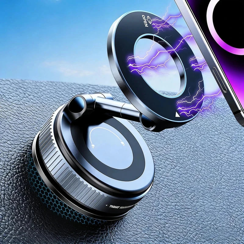 A close-up of a magnetic phone mount with a rotating base and dual vacuum suction, positioned on a dark surface next to a sma