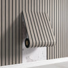 A close-up of a beige striped wall panel with a dark roll visible against a vertical wood slat background.