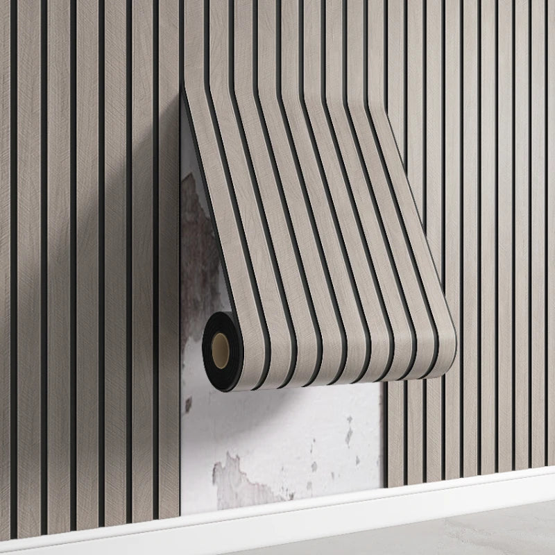 A close-up of a beige striped wall panel with a dark roll visible against a vertical wood slat background.