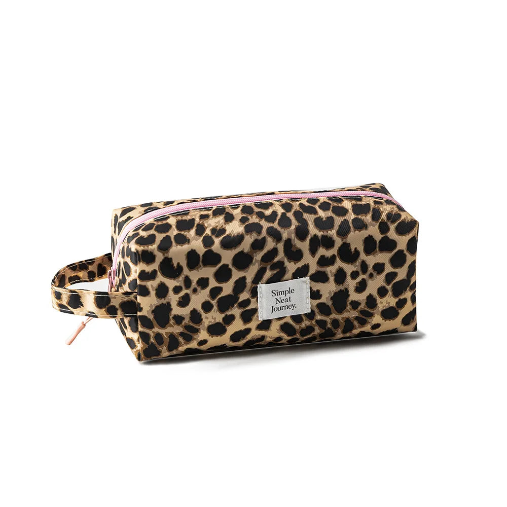 A leopard print toiletry bag with a pink trim and a small tag is shown on a white background.