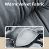 Close-up of a dark gray velvet fabric showing soft texture and folds.