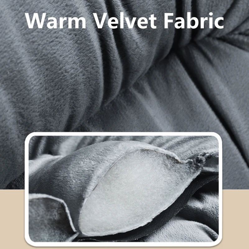 Close-up of a dark gray velvet fabric showing soft texture and folds.