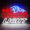An LED neon sign featuring a mountain logo and the words COOLS LIGHT illuminated against a dark background.