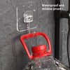 Red rotating wall hooks with a clear adhesive plate mounted on a dark gray textured wall.