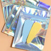 A pack of holographic rainbow self-sealing bags with clear windows containing blue and yellow items.