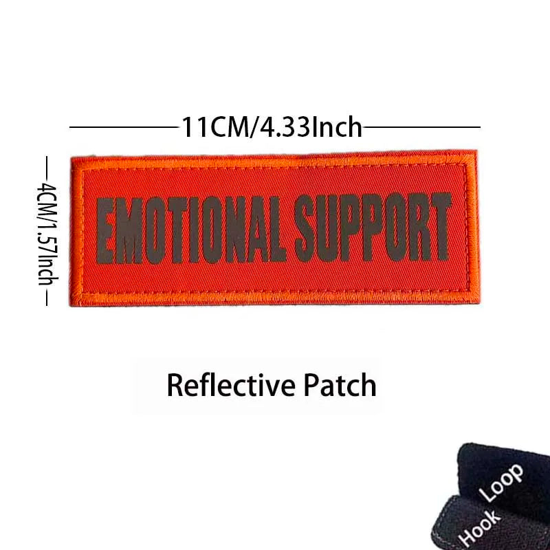 An orange embroidered patch with black text reading EMOTIONAL SUPPORT and reflective details.