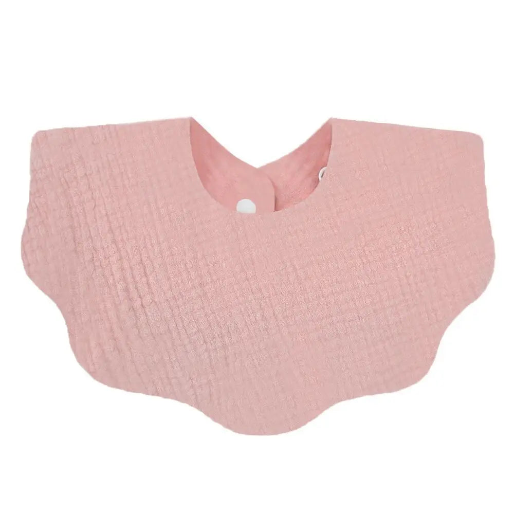 A light pink, textured baby bib in a bandana style for newborns.
