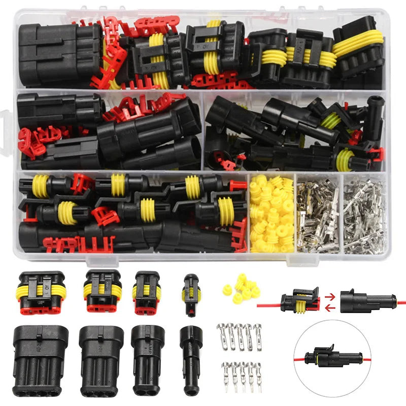 A plastic kit containing various male and female electrical connectors for automotive use, including terminals and plugs.