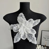 Silver sequin floral lace applique patch displayed on a black mannequin.