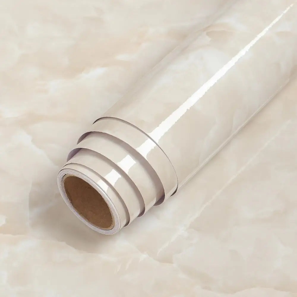 Roll of beige marble contact paper for kitchen and furniture