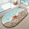 A beige anti-slip bathroom rug with a light blue wave design, a starfish, and seashells on a wooden floor.