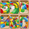 A set of STEM electric train building blocks featuring various tracks and components in colorful plastic.