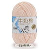 A ball of light pink milk cotton blend yarn for knitting and crochet projects.