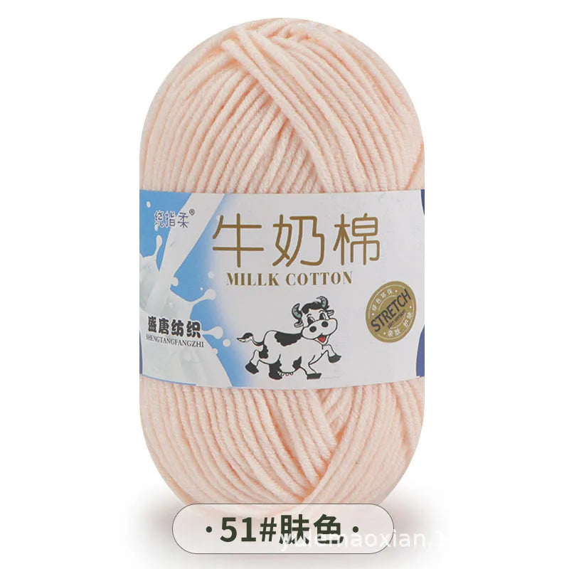 A ball of light pink milk cotton blend yarn for knitting and crochet projects.