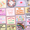 A collection of colorful letter embroidered patches for jackets and clothing featuring words like Girl Power No Weenies Allow