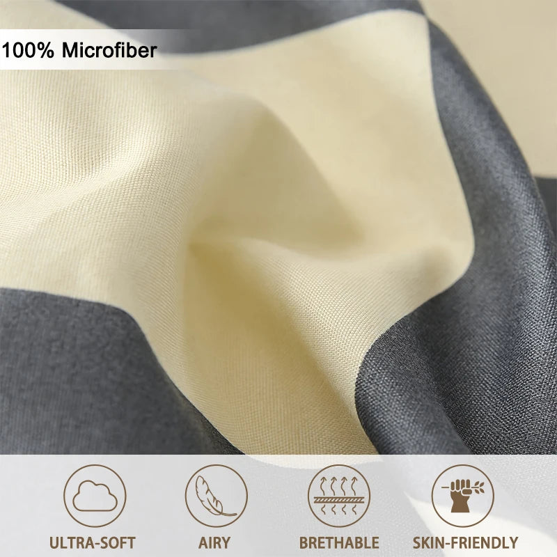 Close-up of checkered beige and gray microfiber fabric showing ultra-soft, airy, breathable, and skin-friendly texture.